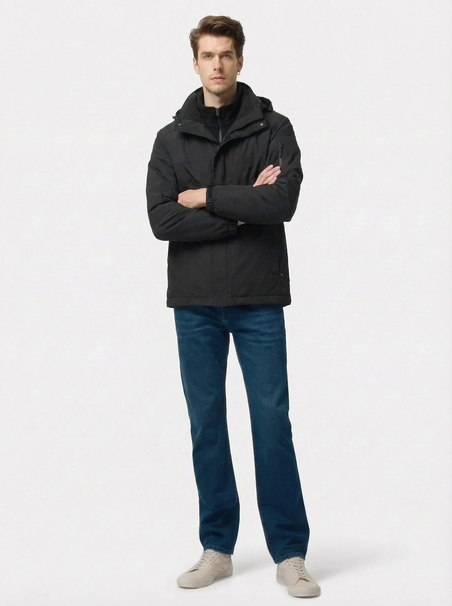 Man wearing a black jacket and blue jeans