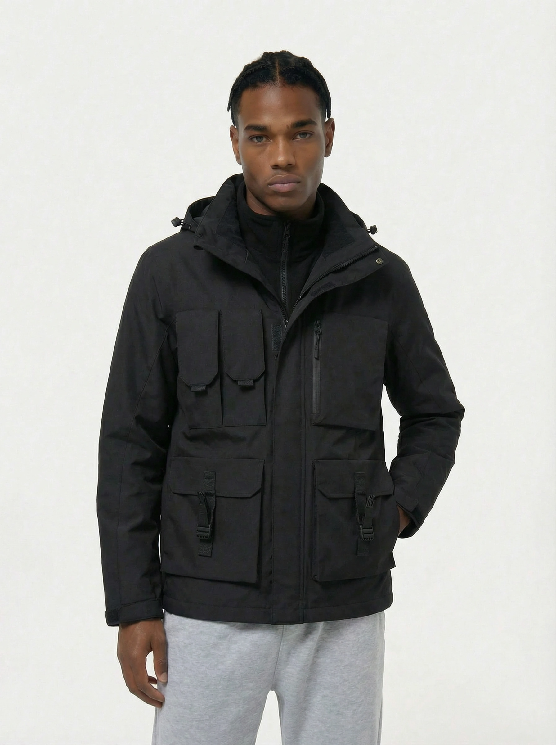 Man wearing a black jacket with a hood 