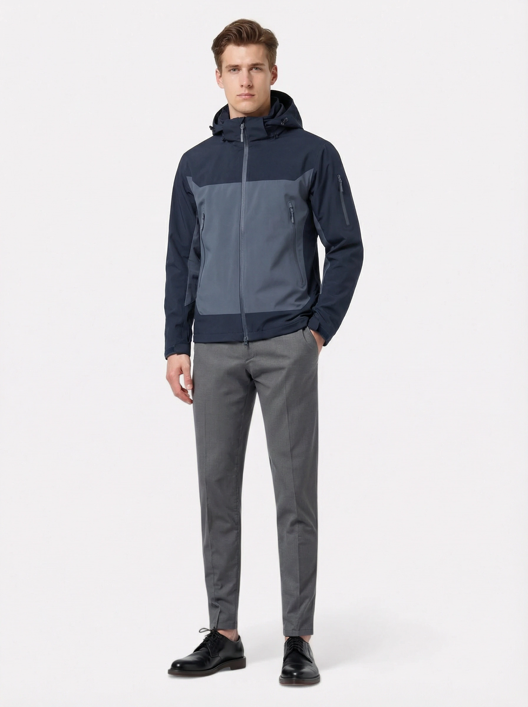 Man wearing a two-tone jacket and gray pants 