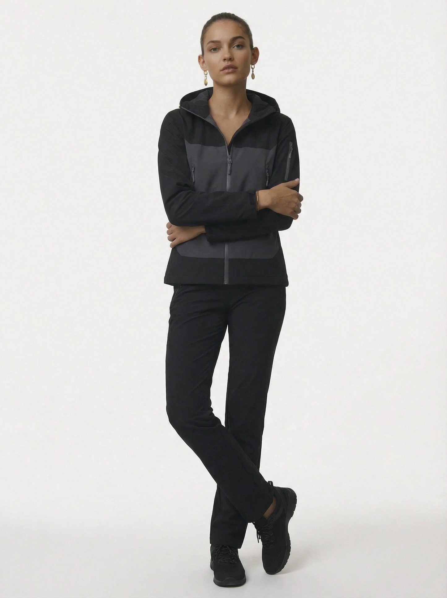 Person wearing a black tracksuit