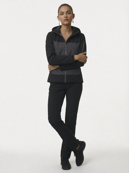 Person wearing a black tracksuit