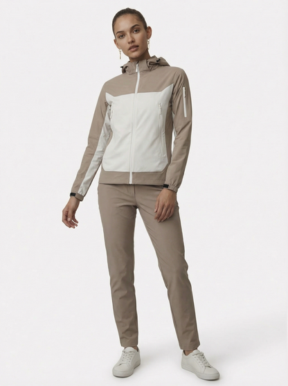 Woman wearing a beige and white tracksuit