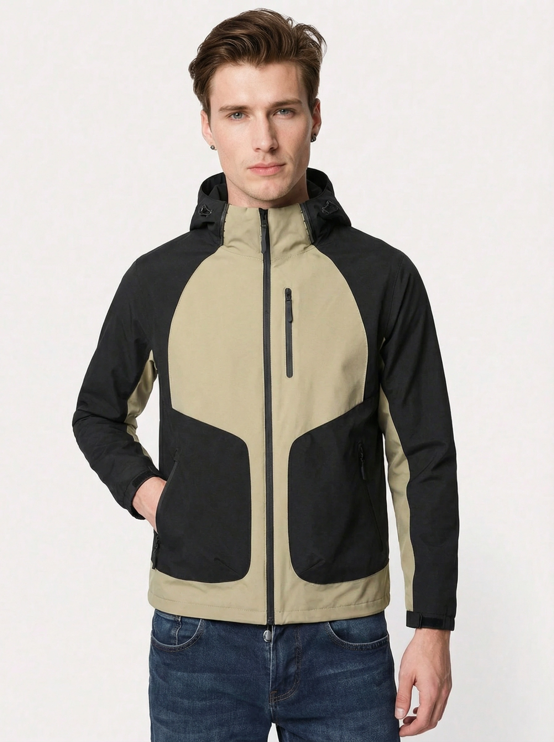 Man wearing a two-tone jacket with beige and black sections