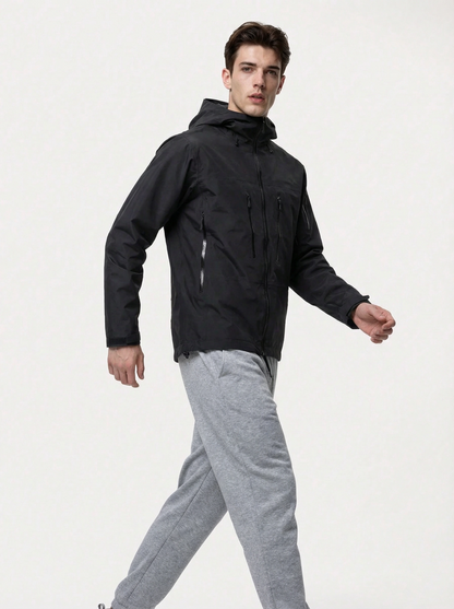 Man wearing a black jacket and gray pants 