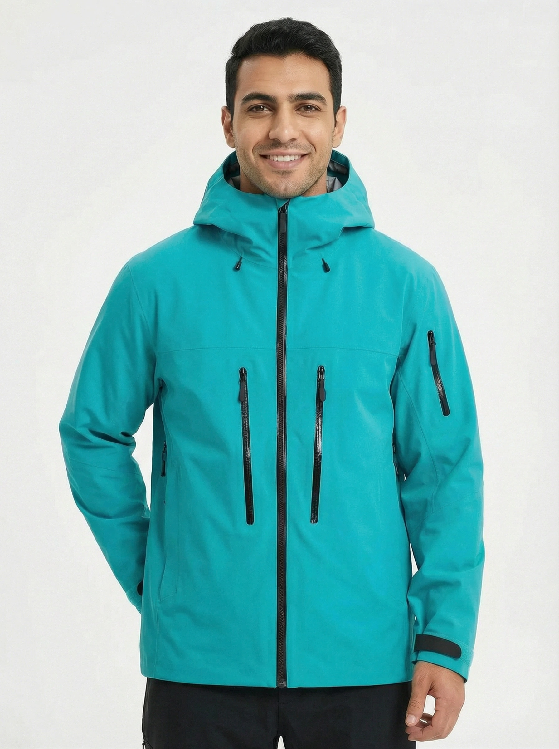 Man wearing a teal jacket with a hood 