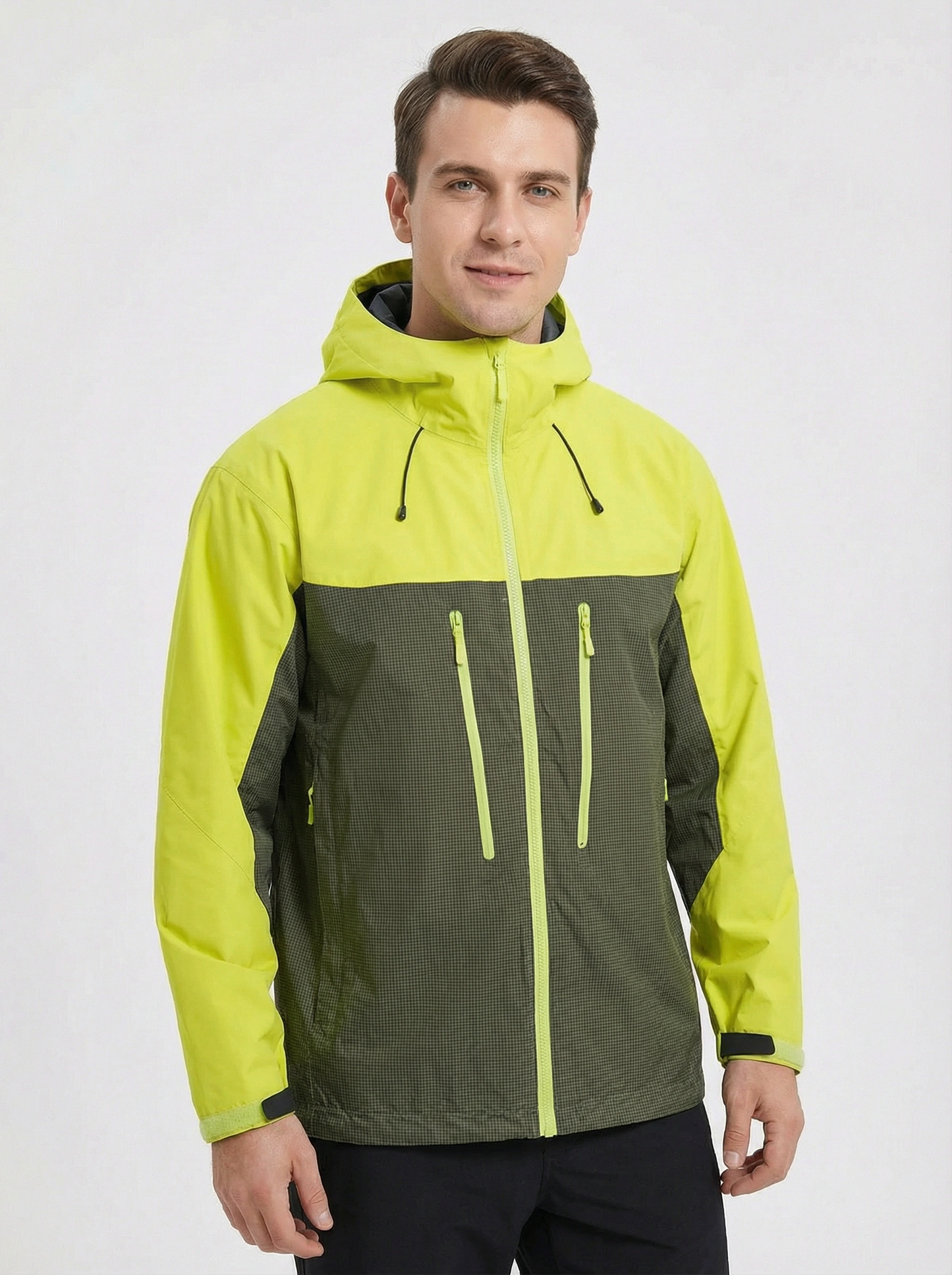 Man wearing a two-tone green and black jacket