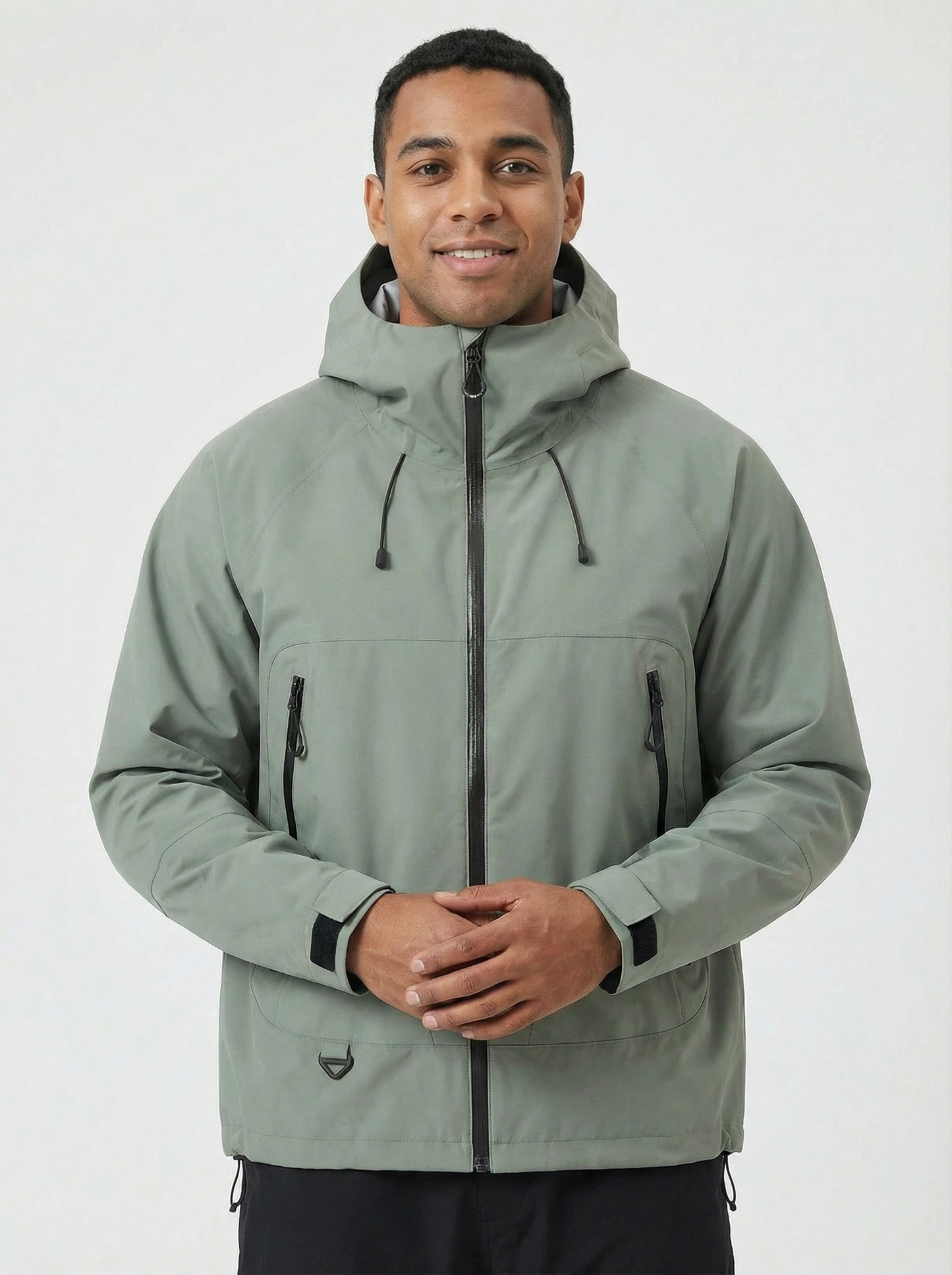 Man wearing a green jacket with a hood