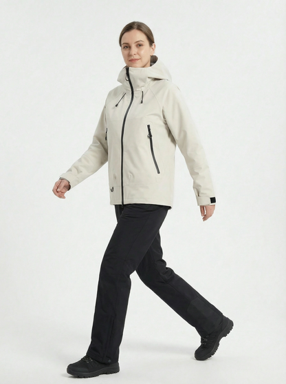 Woman wearing a beige jacket and black pants